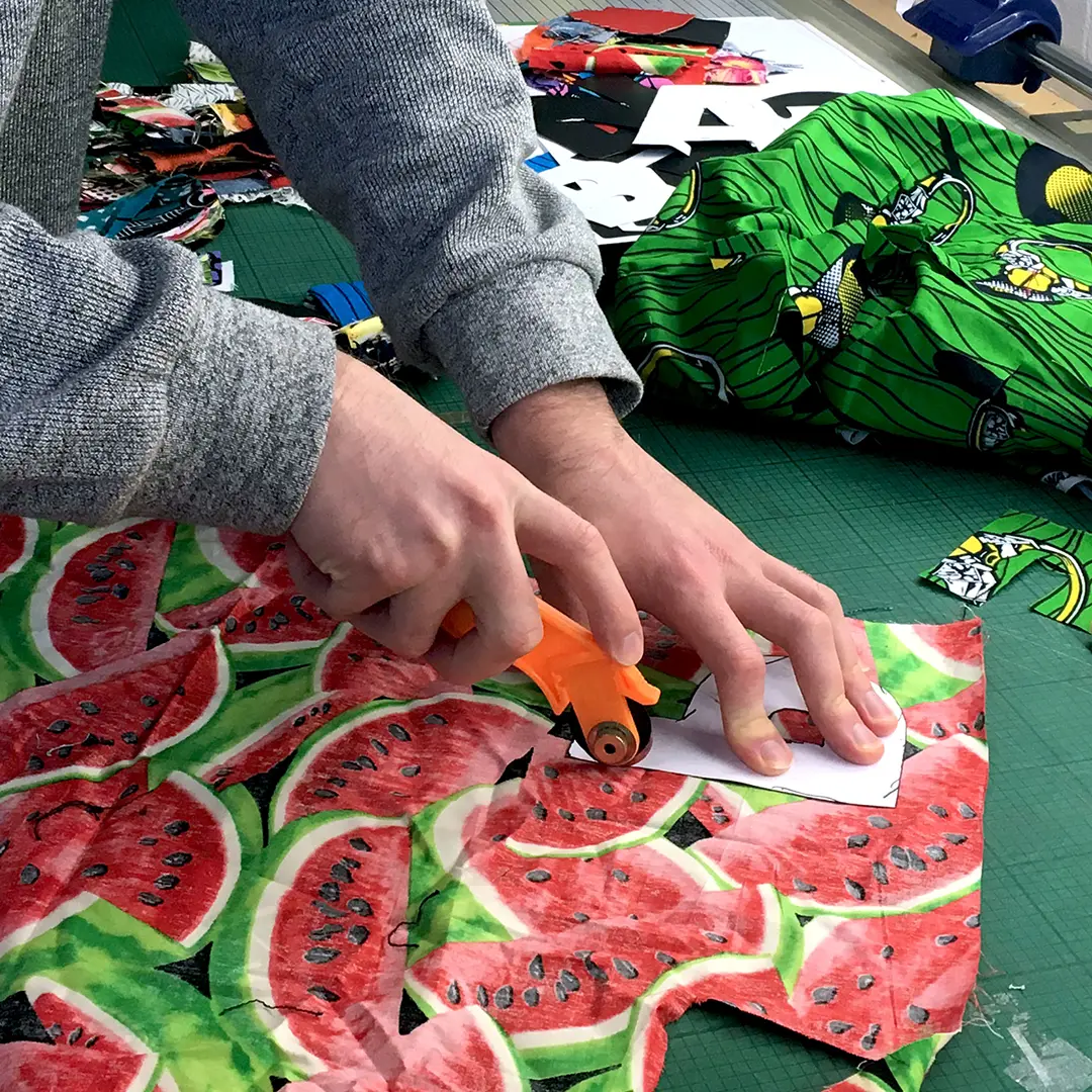 Petticoat Lane Market cutting out fabric letters